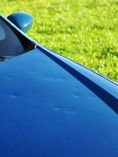 Hail damage on hood of car.