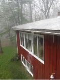 Heavily raining on house.