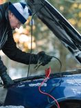 Man Using Jumper Cables