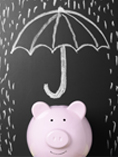 Chalk drawn umbrella over piggy bank