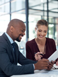 Woman going over paperwork with man..