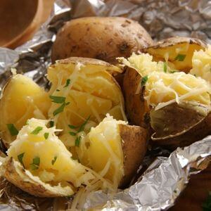 Photo of pieces of potato baked in aluminum foil